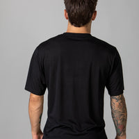 Back of Pedro in our classic sustainable t-shirt in Onyx.