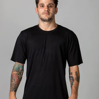 Pedro in our classic sustainable t-shirt in Onyx (black), made from 35% organic cotton and 65% rPET. A sustainable shirt that doesn't cost the earth. Carbon neutral delivery, tree planting, biodegradable packaging.