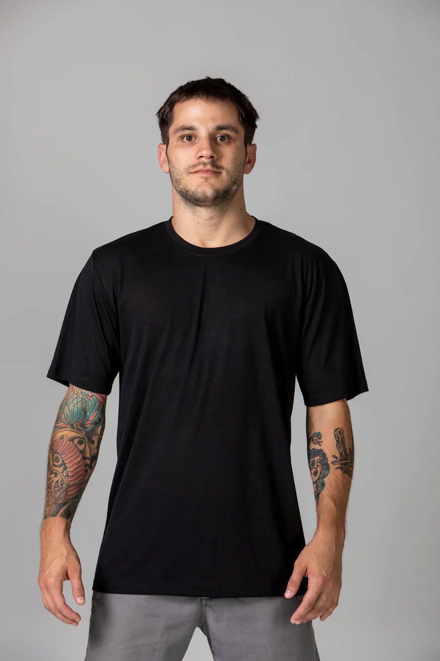 Pedro in our classic sustainable t-shirt in Onyx (black), made from 35% organic cotton and 65% rPET. A sustainable shirt that doesn't cost the earth. Carbon neutral delivery, tree planting, biodegradable packaging.